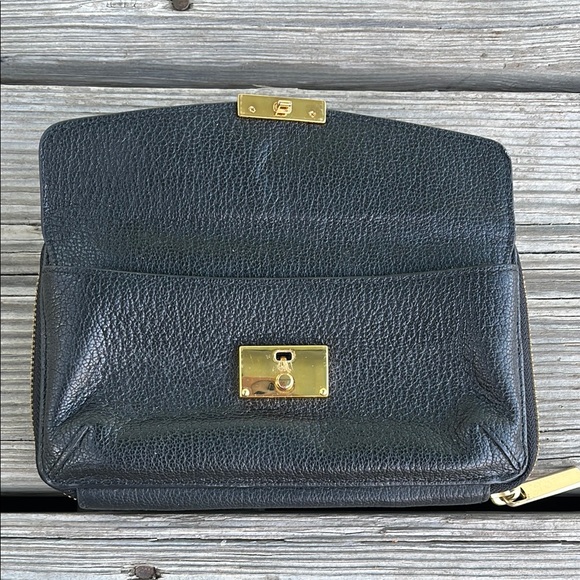 Tumi Black and Gold Pebbled Leather Wristlet